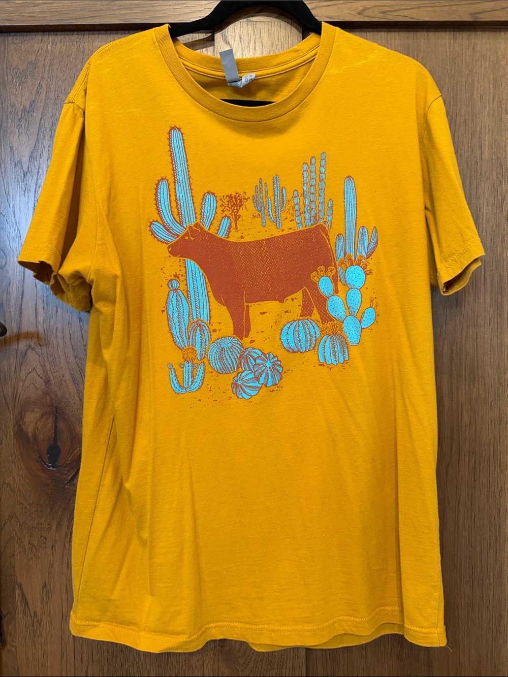 Next Level Apparel Mustard Yellow Desert Graphic Tee with Blue Accents